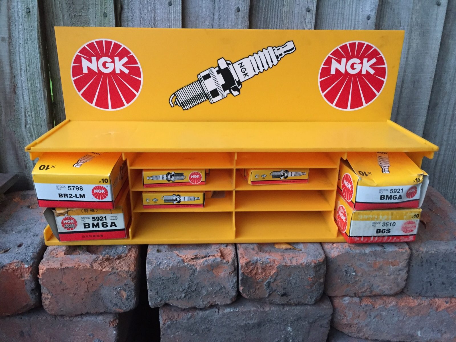 Classic NGK spark plug display rack unit